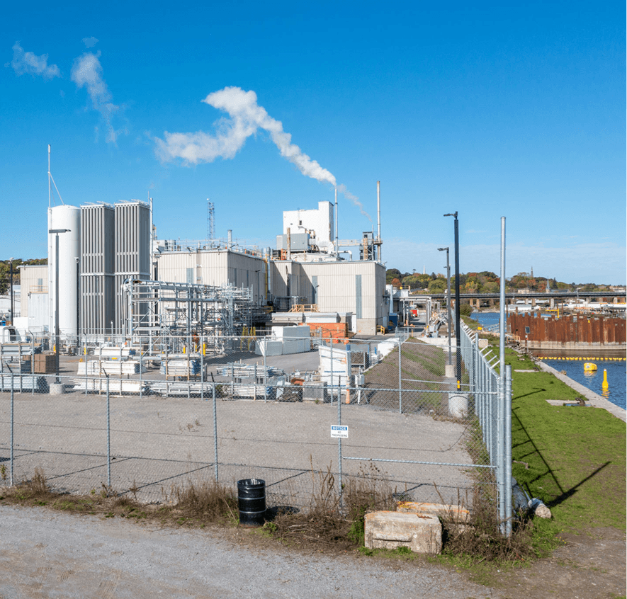 Factory with fenced perimeter and clear sky