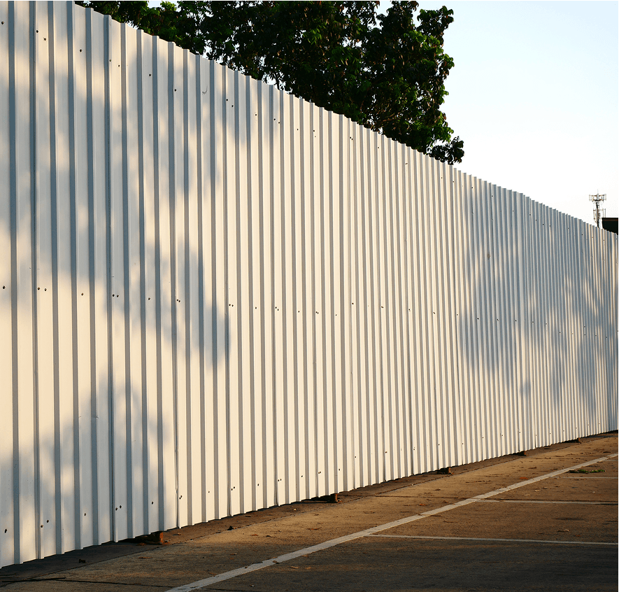 White metal fence with tree shadows